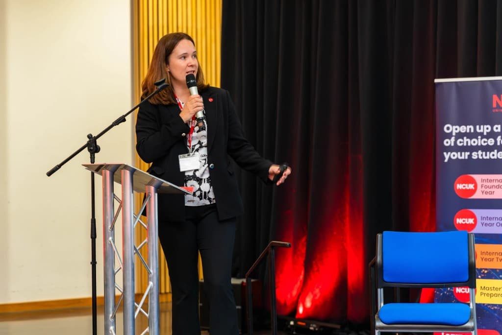 An NCUK colleague speaking at a previous partner gathering